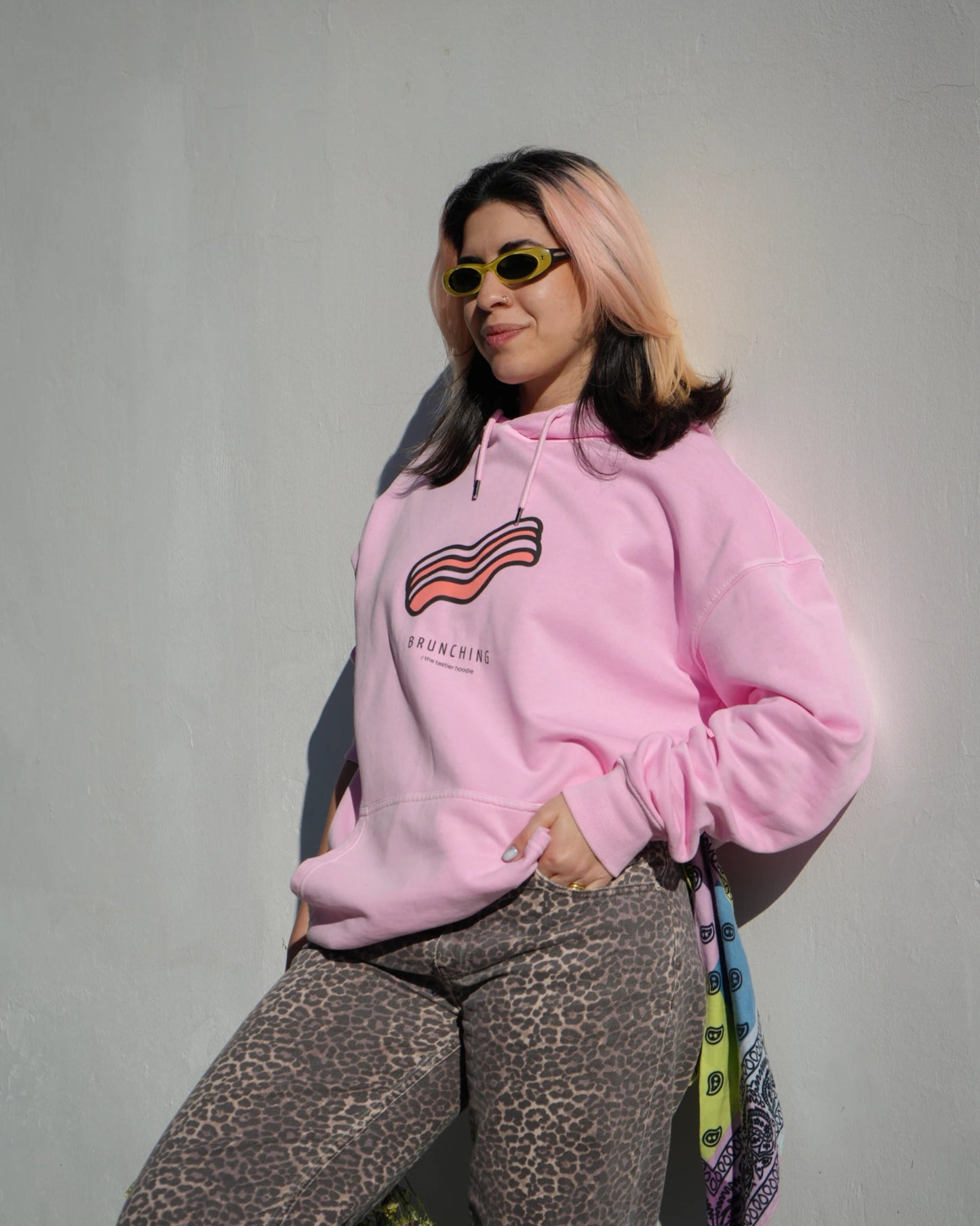 girl-pink-hoodie-bacon-standing