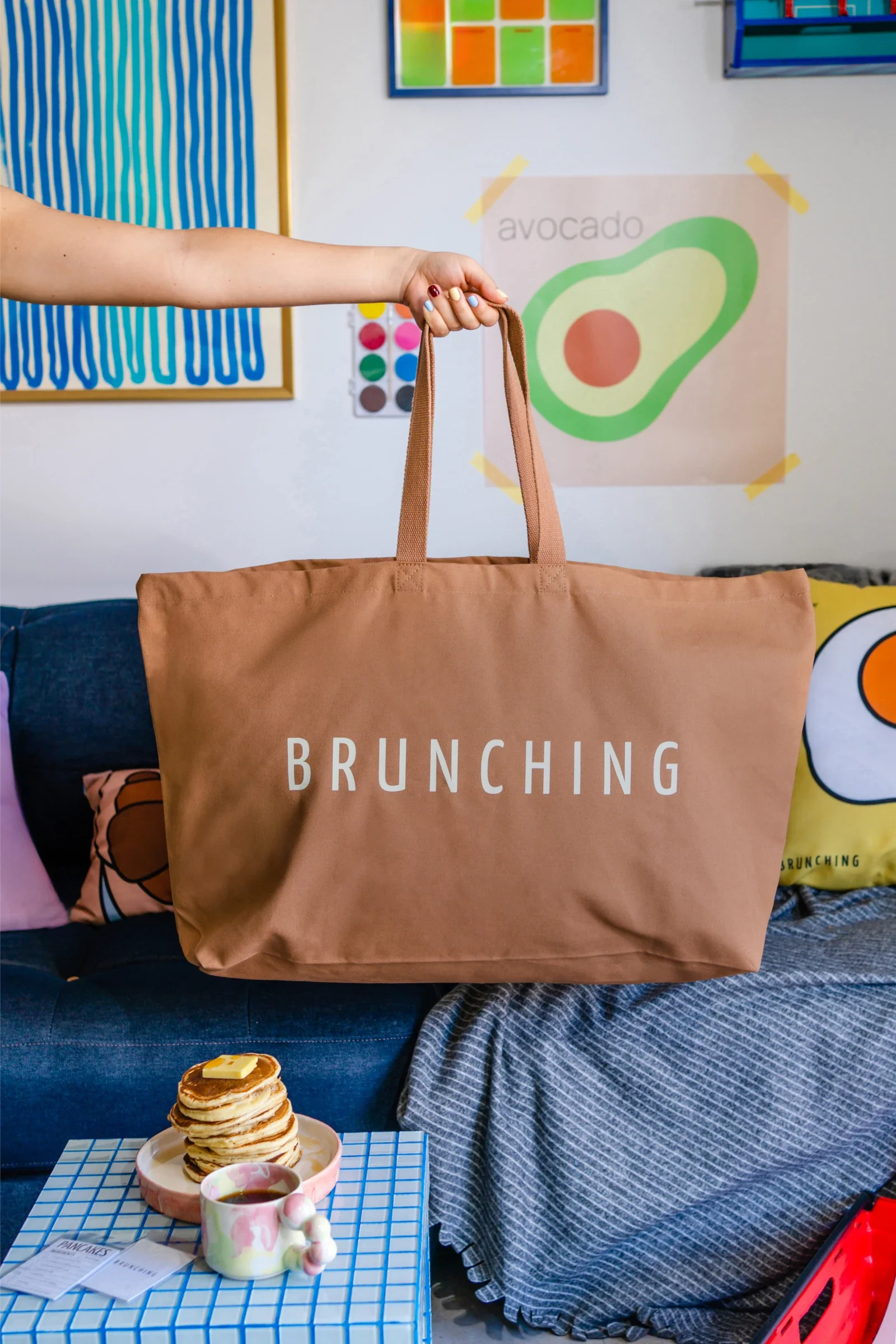 BRUNCHING sale — models holding Go Big or Go Home tote bags